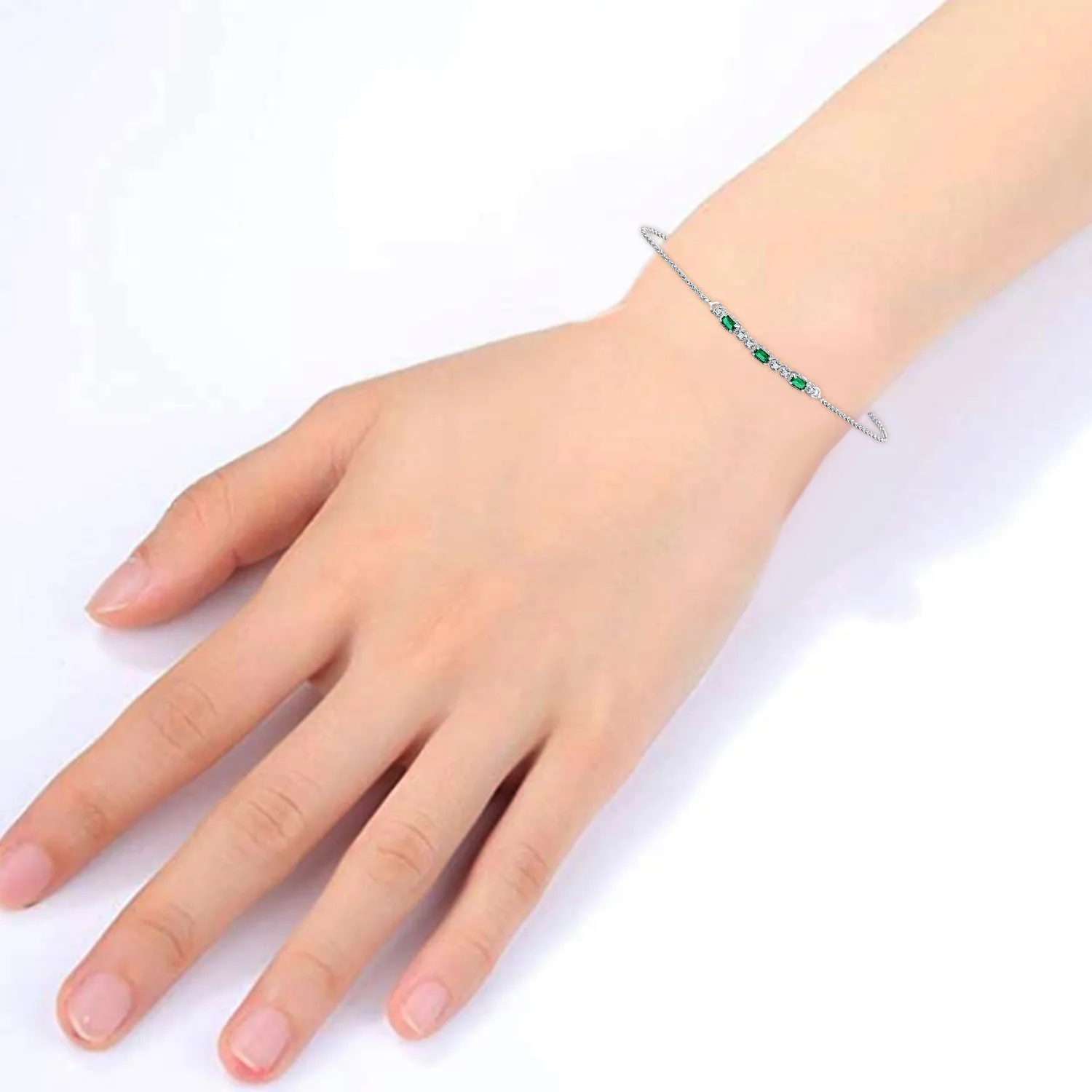 Jewelili Sterling Silver 4x2 MM Baguette Simulated Green Emerald and Round Created White Sapphire Bolo Bracelet, 9.5"